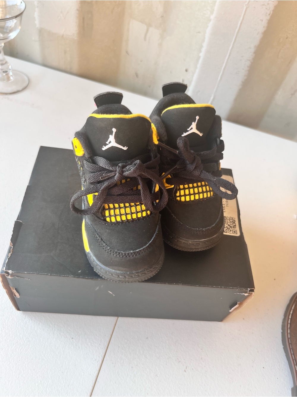 Retro 4’s size 5C, Jordan Kids' Black and Yellow Basketball Sneakers